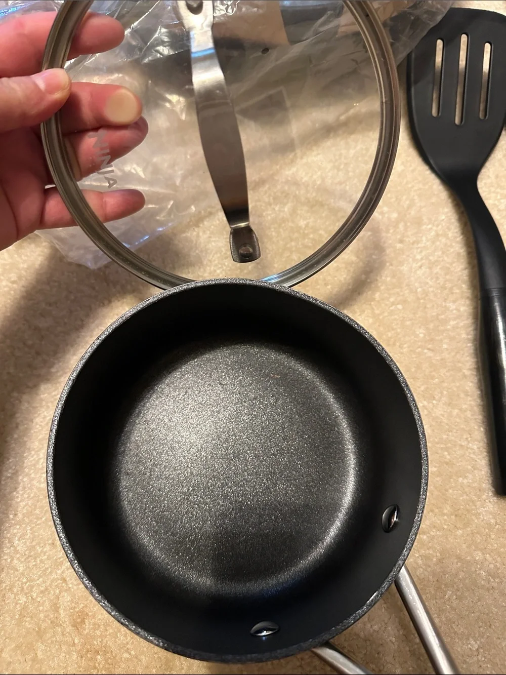 Ninja cookware set in black and stainless steel with glass lid